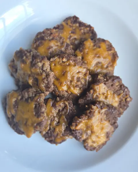 Plate of treat clusters with a cheesy topping